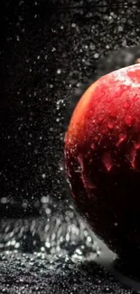 Close-up of a vibrant red apple with water droplets on a dark background.