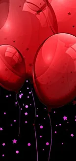 Vibrant red balloons with starry black background, perfect for phone wallpaper.