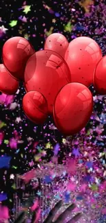 Red balloons in a colorful festive wallpaper with confetti and stars.