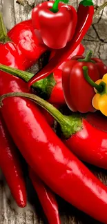 Vibrant red chili peppers with colorful bell peppers on a rustic background.