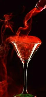 Red cocktail with smoky effect on black background.