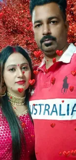 Couple posing with a red foliage background.