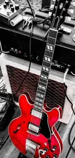 Vibrant red electric guitar and amp setup for mobile wallpaper.