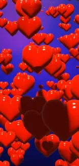 Vibrant red hearts on blue background wallpaper for mobile.