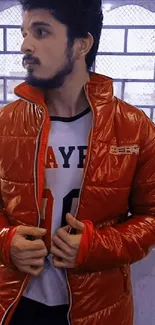 Man in vibrant red jacket standing indoors.