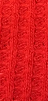 Vibrant red knitted pattern texture wallpaper.