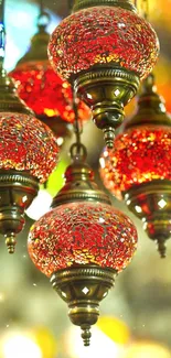 Vibrant red lanterns with intricate designs casting a warm, cozy light.