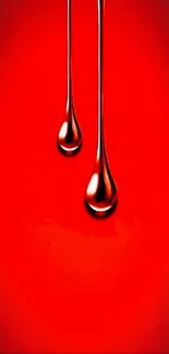 Vibrant red wallpaper with glossy liquid drops design.