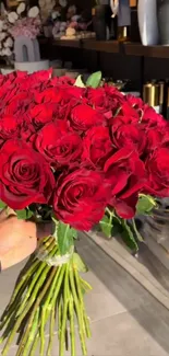 A stunning bouquet of red roses in sunlight.