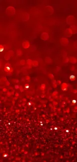 Vibrant red glitter bokeh wallpaper with sparkling texture.