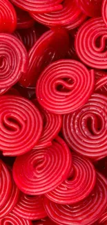 Close-up view of red candy spirals for mobile wallpaper.