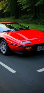 Vibrant red sports car on a scenic road surrounded by nature.