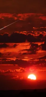 Red sunset with dramatic clouds and horizon glow.