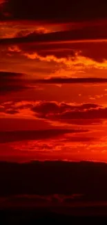 Vibrant red sunset with fiery clouds wallpaper.