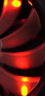 Vibrant red tech fan glowing brightly in the dark.