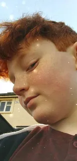 Close-up portrait of a young redhead in natural light.