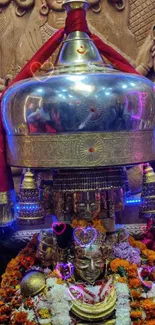 Colorful religious altar with gold artifacts and floral decorations.