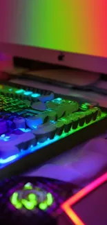 A vibrant RGB gaming setup with mechanical keyboard and monitor.