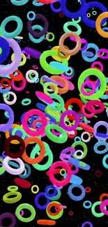 Vibrant mobile wallpaper with colorful rings on black background.