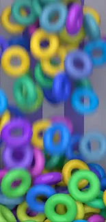 Colorful rings cascading in a dynamic pattern with vivid colors, creating a lively visual.