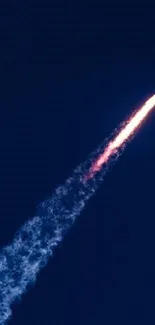 Stunning image of a rocket launch against a dark blue sky with vibrant colors.