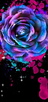 Bright neon pink and blue rose on black background with paint splashes.