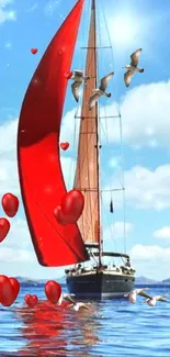 Red sailboat with hearts and seagulls on the ocean under a blue sky.