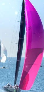 Sailboat with magenta sail on the open sea.