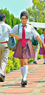 Students in uniforms walking outdoors.