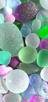 Colorful sea glass pebbles forming a vibrant and textured mobile wallpaper.