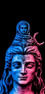 Colorful Shiva statue in blue and pink on black background.