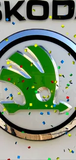 Green Skoda logo with colorful confetti.