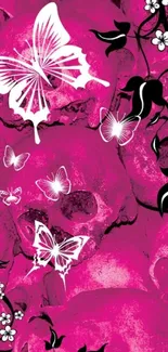 Vibrant pink skulls with butterflies and floral pattern wallpaper.