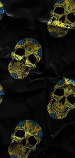 Vibrant yellow and blue skulls on black background wallpaper.