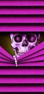 Vibrant pink skull art design on a phone wallpaper.