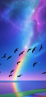 Vibrant starry sky with rainbow and bird silhouettes over water.