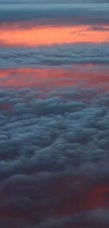 Vibrant sunset sky with clouds in fiery orange and blue hues.