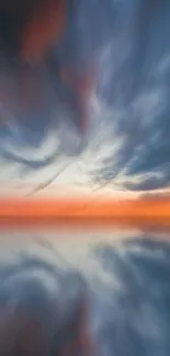 Vivid sunset sky with dramatic clouds reflecting on water.