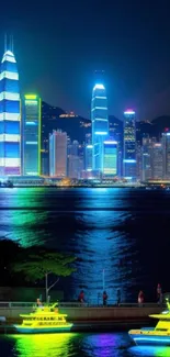 Neon-lit city skyline reflected in river at night.