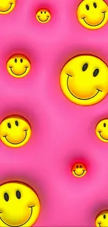 Pink wallpaper with yellow smiley emojis.