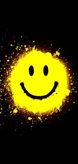 Bright smiley face on black background with yellow paint splatter.