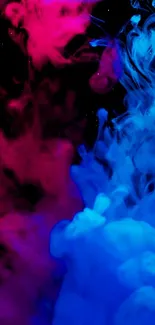 Vibrant smoke in pink and blue hues creating an abstract art effect.