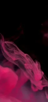 Artistic pink smoke swirling on dark background.