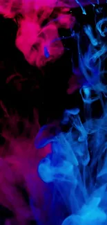 Vibrant blue and pink smoke art on black background.