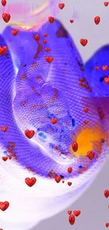 A vibrant blue snake with heart decorations on a smartphone wallpaper.