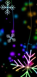 Neon snowflake wallpaper with bokeh effects on black background.