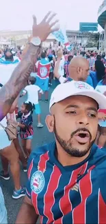 Energetic soccer fans celebrating outside a stadium in colorful jerseys and caps.