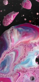 Vibrant pink and blue cosmic wallpaper with abstract swirls.