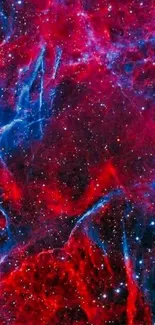 Vibrant red and blue nebula wallpaper with stars.