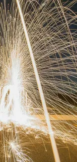 Dynamic spark shower with light trails on a dark background.